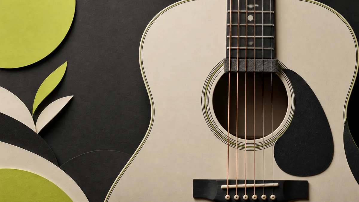 A close-up acoustic guitar with a soft dark strip resting across the strings.